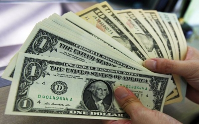 Dólar opera em alta, acima de R$ 3,60