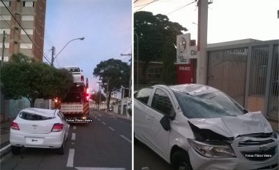Carreta se enrosca em fios e carro é derrubado
