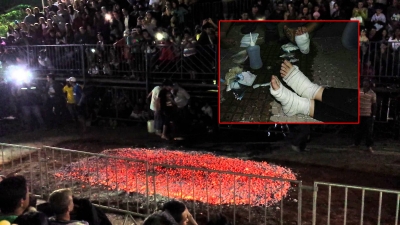 Fiéis sofrem queimaduras ao passar por fogueira 