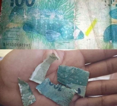 Mulher usa nota falsa de R$ 100 para comprar doces de menino em semáforo